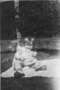 March 1946. Sunbathing by the fence at Grandfather William Shoemake's home